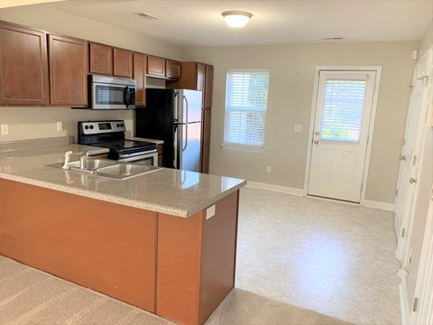 a kitchen with a counter top and a refrigerator