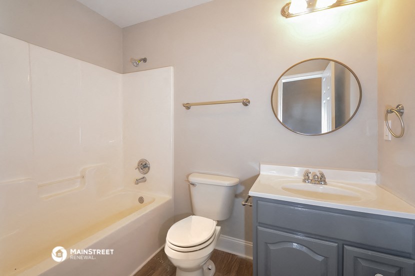 a bathroom with a sink toilet and a bath tub