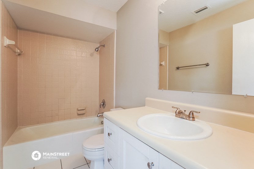 a bathroom with a sink and a tub and a toilet
