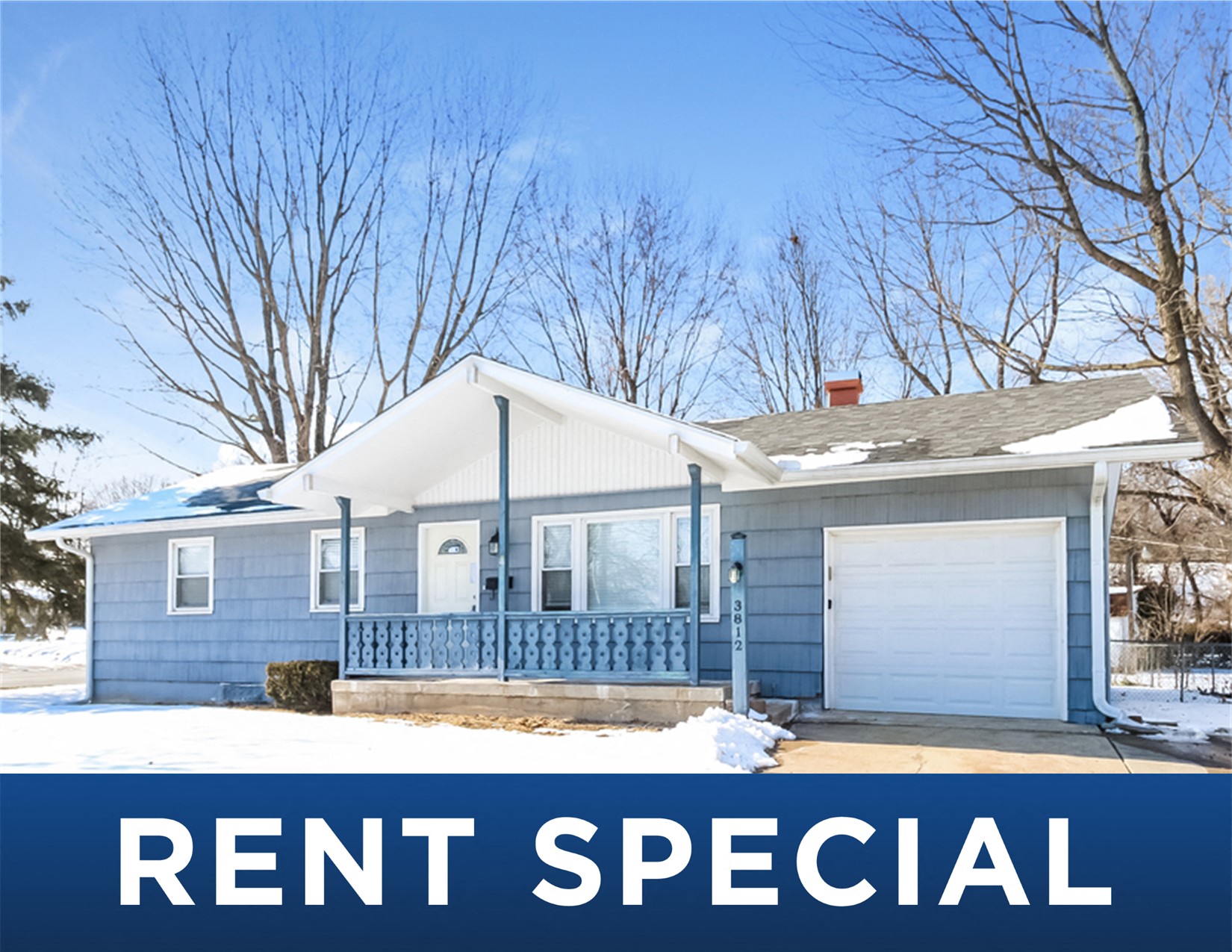 a blue house with snow on the ground and the words rent special