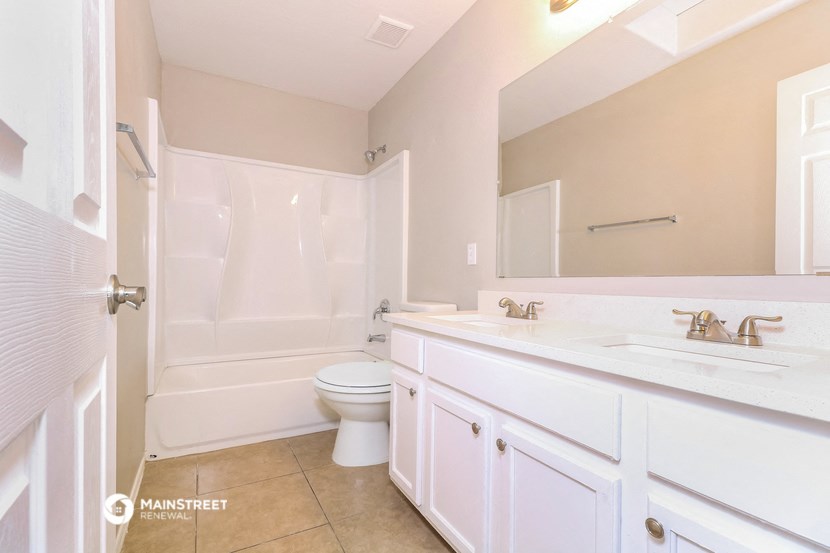 a bathroom with a sink toilet and a shower