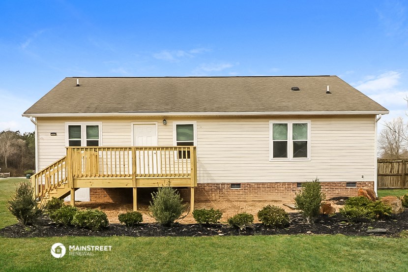 a manufactured home with a porch and a deck