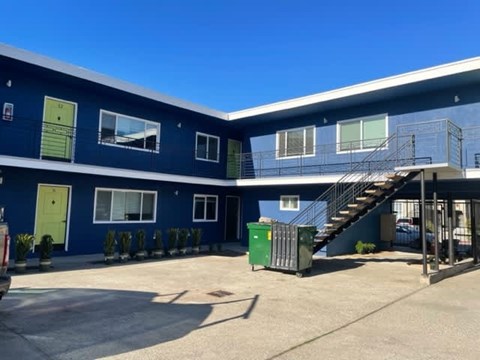 A blue building of 1640 6th Ave.