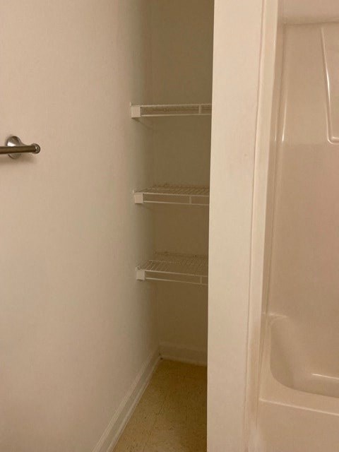 A white door with a handle is open.