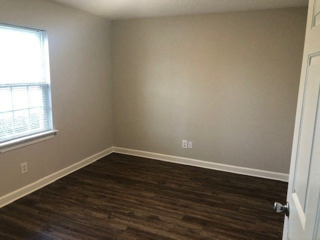 A room with a window and a door.