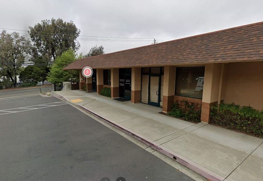 a building with a no parking sign in front of it