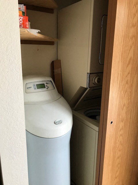 a small bathroom with a toilet and a trash can