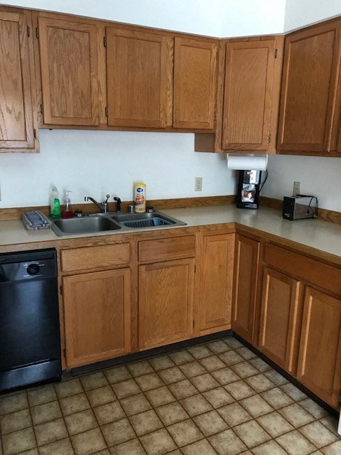 a kitchen with wooden cabinets and a sink