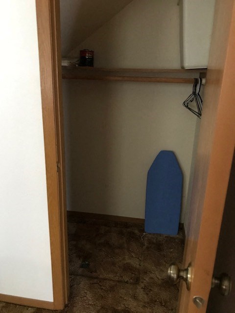 a small bathroom with a blue toilet in it