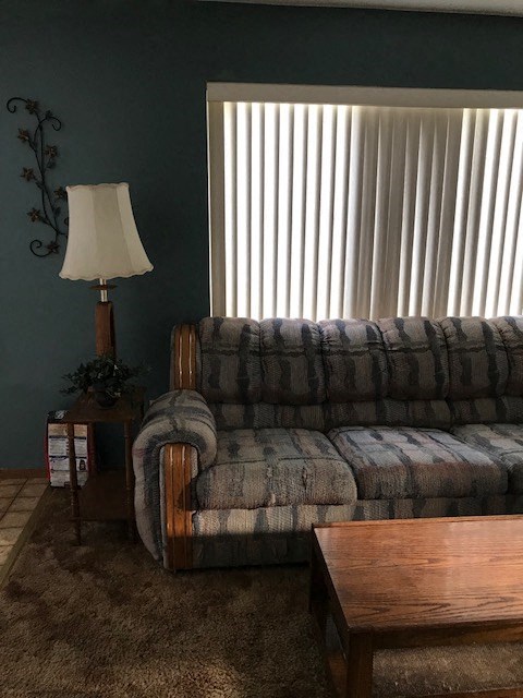 a living room with a couch and a table