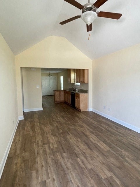 A room with a ceiling fan and wooden flooring.