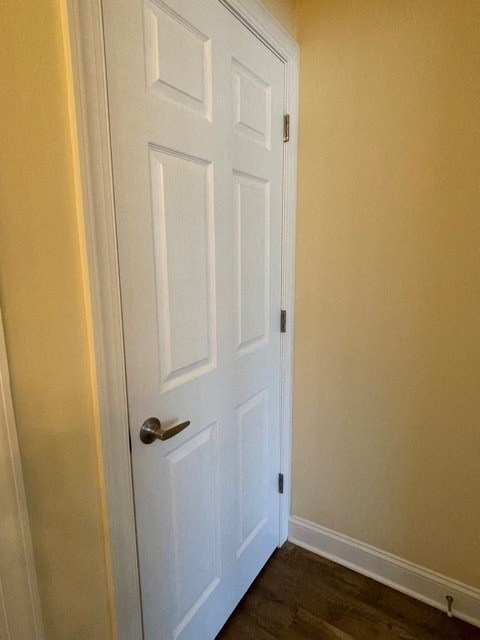 A white door with a silver handle is closed.
