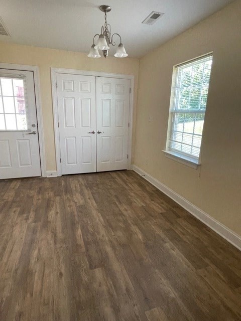 A room with a white door and a window.