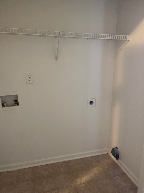 A white wall with a small hole in it.