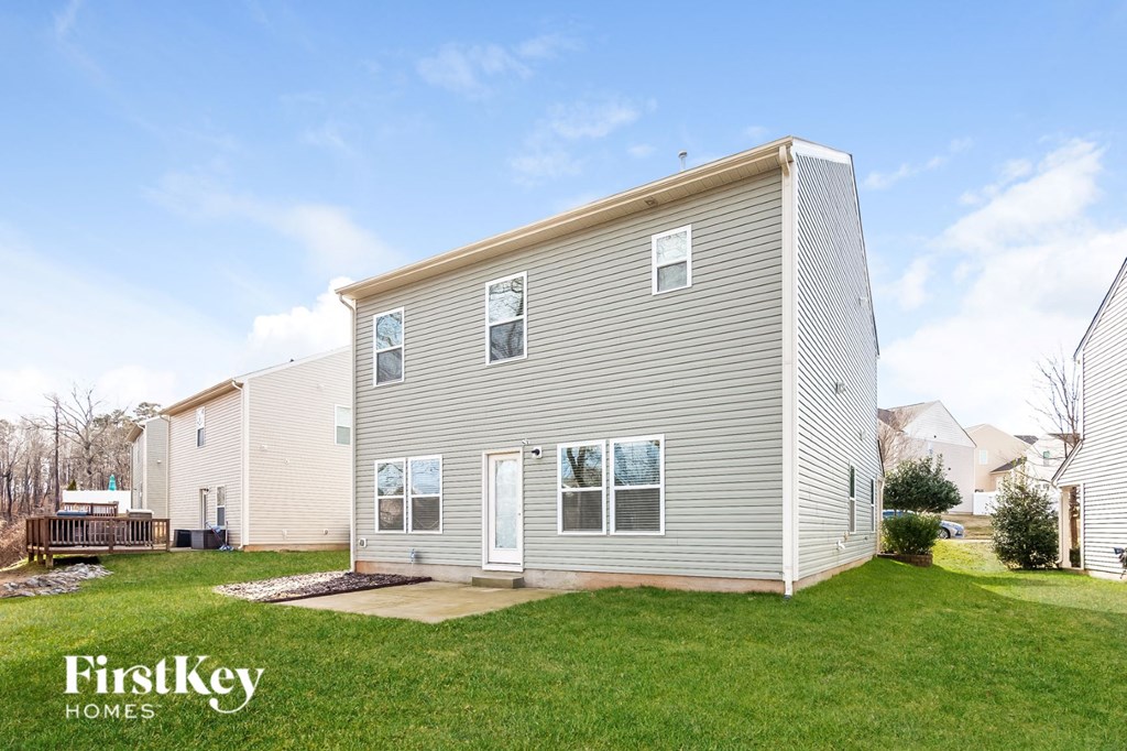 A two-story house with a garage is for sale.