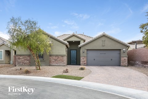 a house with a driveway and a garage door