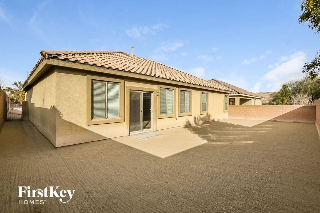 a home with a driveway and a house with windows