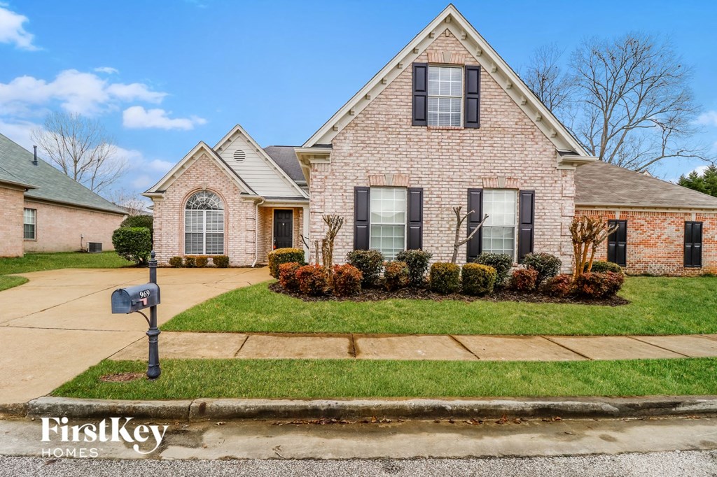 home for sale on the corner of a street with a mailbox