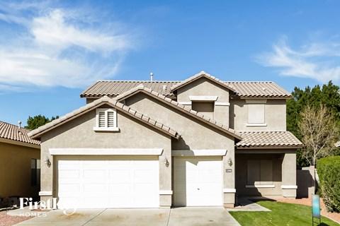 a house with a garage and a white garage door