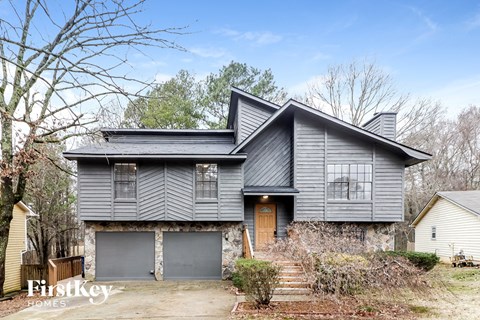 front view of a gray house with gray garage doors