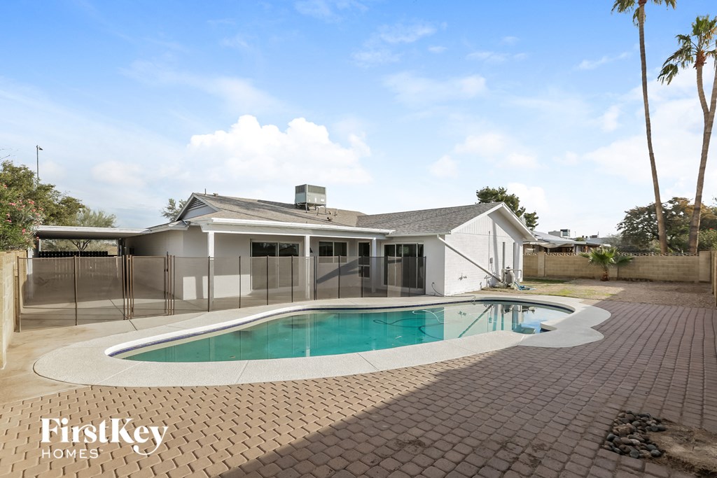 A house with a pool in the backyard.