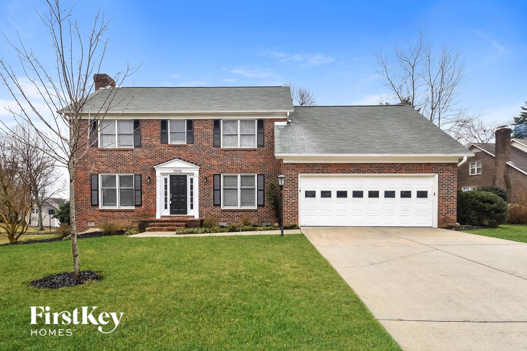a brick house with a white garage door