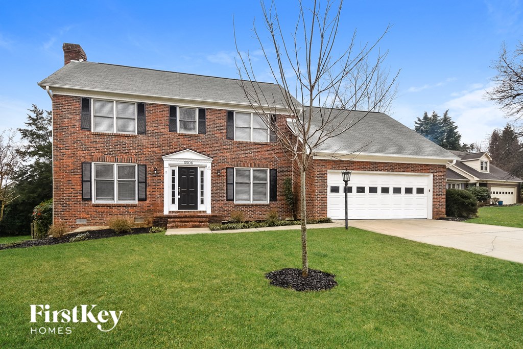 a brick house with a white garage door