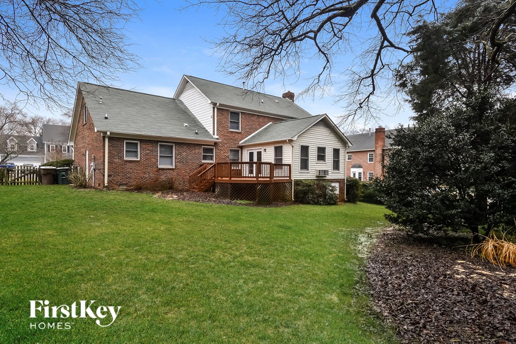 a house with a yard and a deck