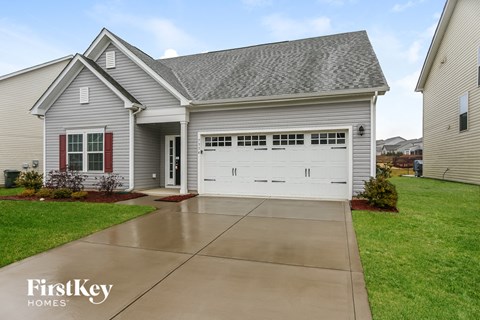 a large white house with a white garage door