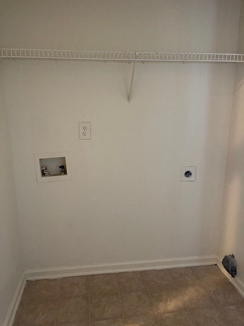 A white wall with a socket and a vent.