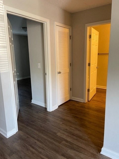 A room with a white door and a yellow door.