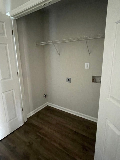 A white door is open to a room with a shelf and a light switch.