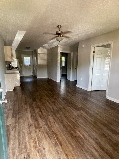 A room with wooden floors and a ceiling fan.