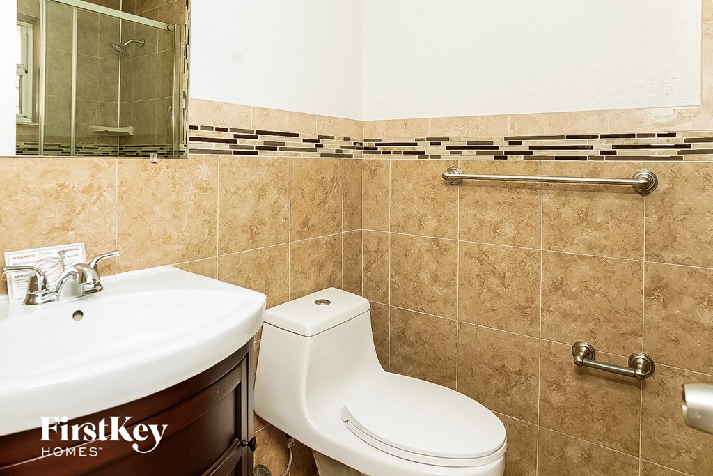 a bathroom with a toilet and a sink