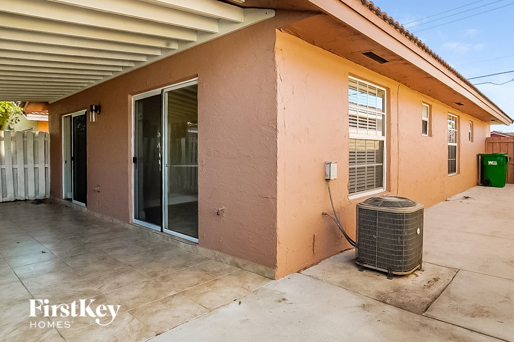 the front of a house with a heater and a door