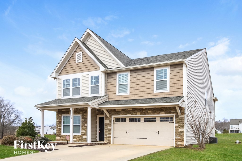 A two-story house with a garage is for sale by FirstKey Homes.