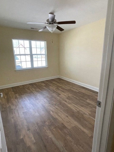 A room with a ceiling fan and a window.