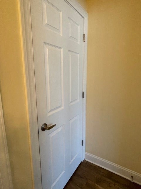 A white door with a silver handle is closed.