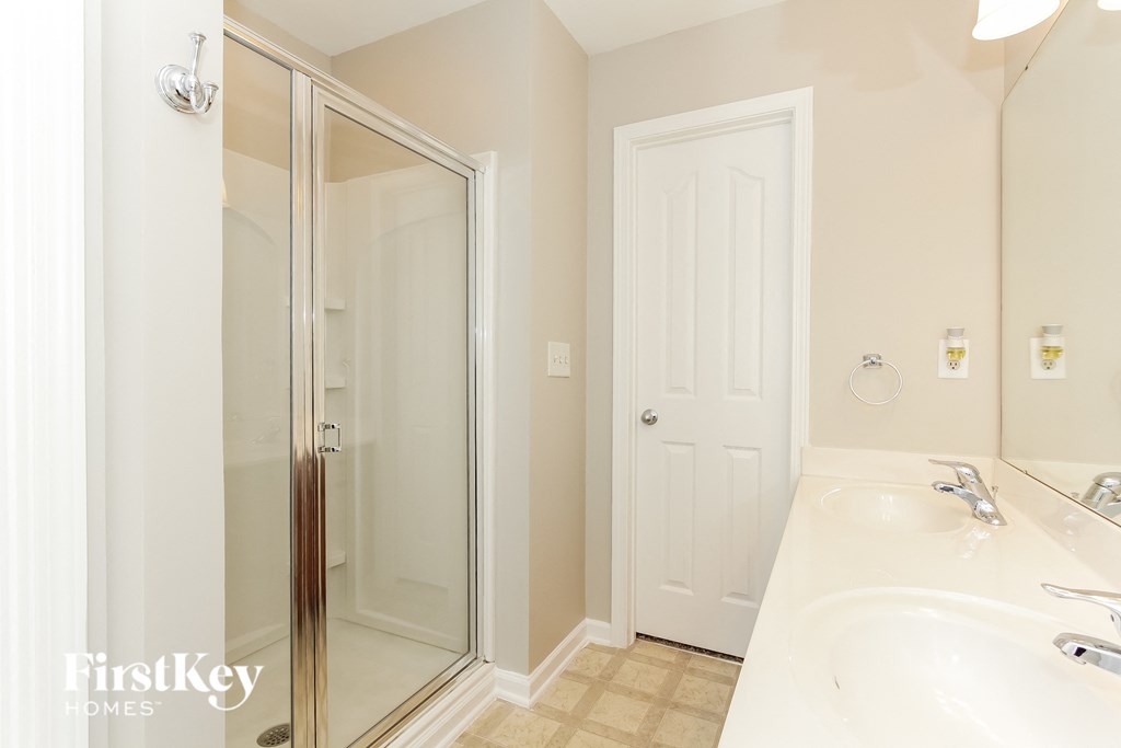 a bathroom with a sink and a shower