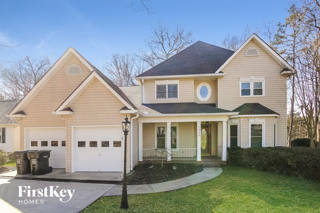 A house with a garage and a driveway is shown.
