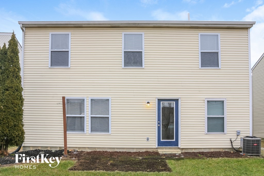 a front view of a house with a blue door
