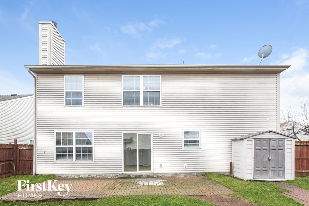 a white house with a satellite dish on top of it