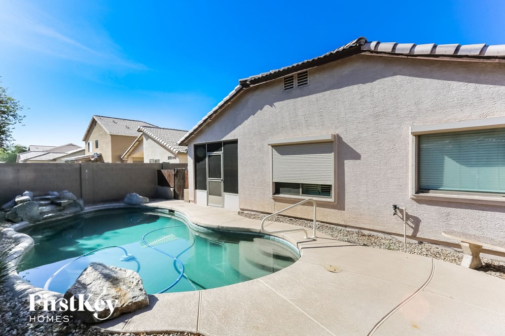 A house with a pool in the backyard.