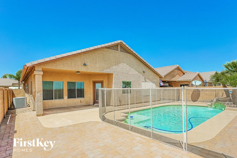 A house with a pool in the backyard.
