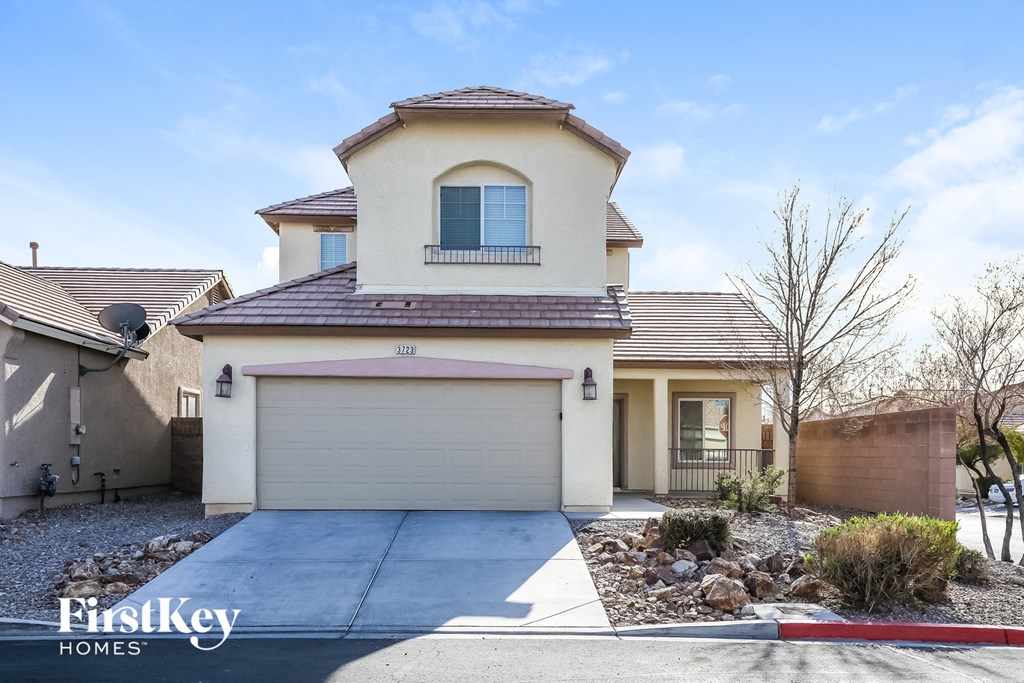 a house with a driveway and a garage door