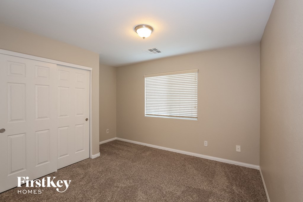 the upstairs bedroom has a closet and a door to the bathroom