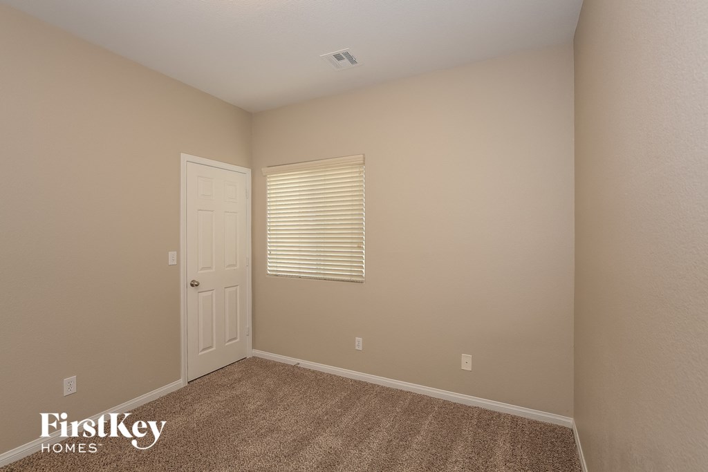 the upstairs bedroom has a door to the closet and a window