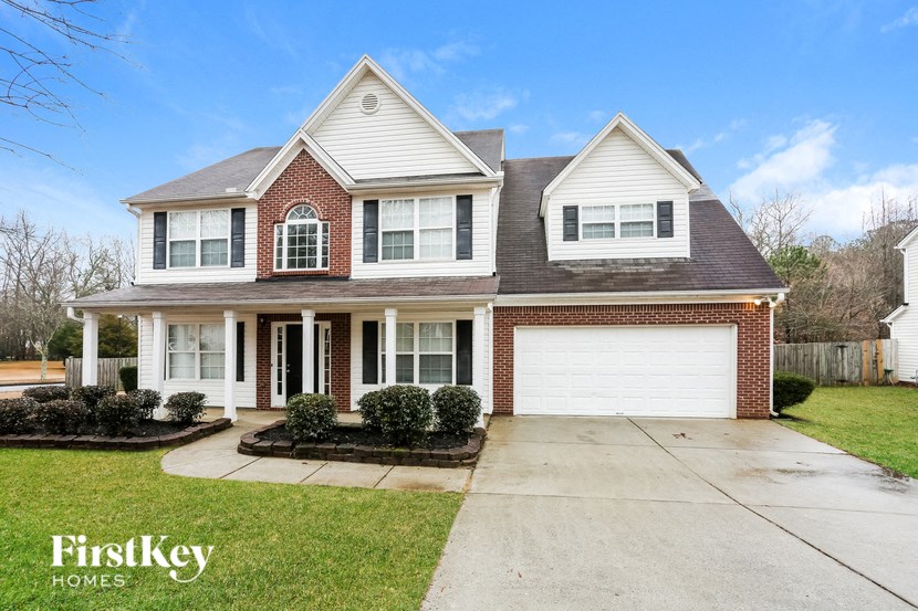 A large house with a garage is for sale.