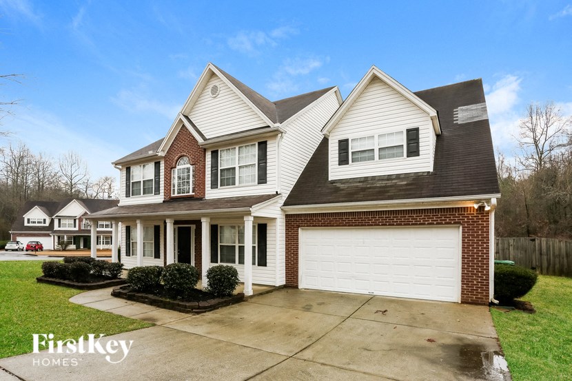A large house with a garage is for sale.