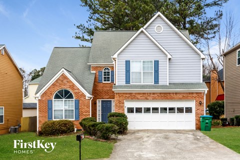 a house with a driveway in front of it